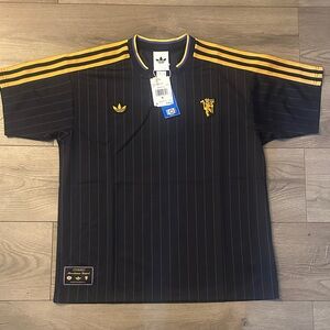 Adidas Men's Black Jersey with Gold Stripes